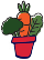 image of a red flowerpot with broccoli, carrot and spinach